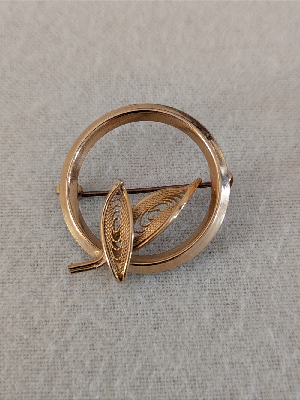 Gold Circle Brooch With Filigree Leaves